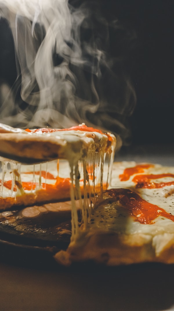Steaming hot pepperoni pizza fresh from the oven at Ganni's Pizzeria Bed-Stuy