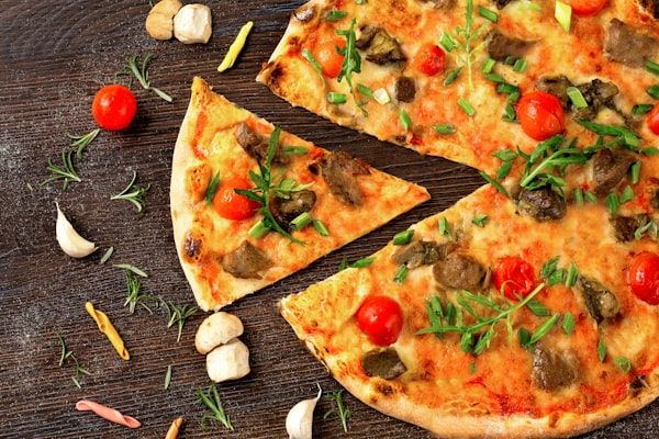 Mushroom pizza with sausage, cherry tomatoes and rosemary